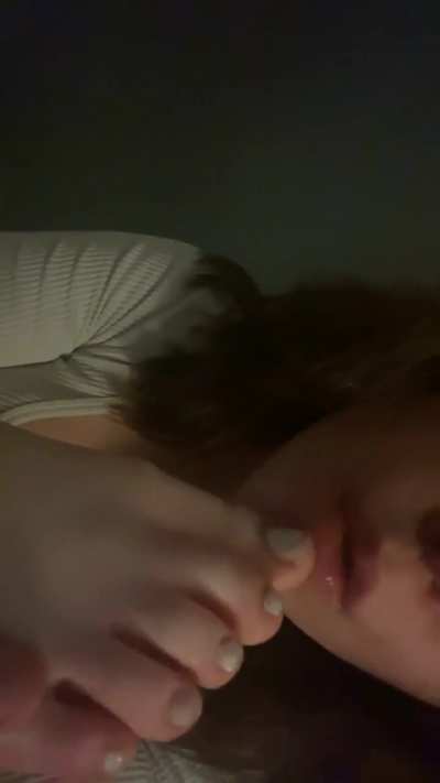 girl sucks her toes