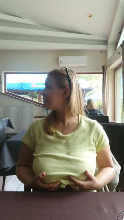 There is a lively discussion behind me about what to choose from the menu, and I have already chosen and am now just showing off my big boobs. Heh