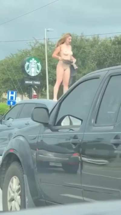 Crackhead climbs on top of a car, strips naked, and starts to flick her bean