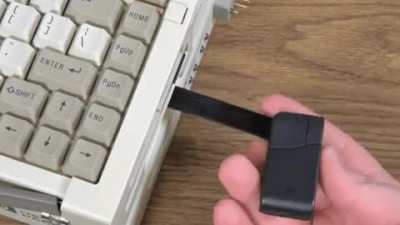 A $20,000 HP 486 Laptop from the late 90&rsquo;s with a pop-out mouse.