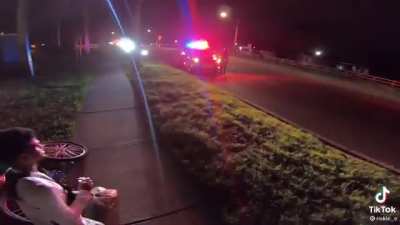 Riding by the cops when they suddenly pull their guns out