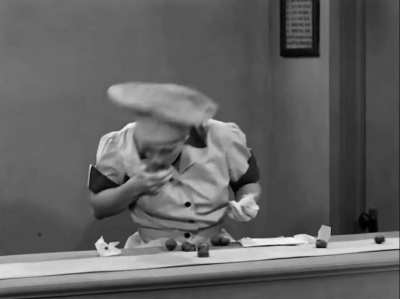 Lucille Ball and Vivian Vance struggle to keep up with a chocolate conveyer belt in a candy factory, in a 1952 episode of "I Love Lucy". Considered one of the series' most iconic moments.