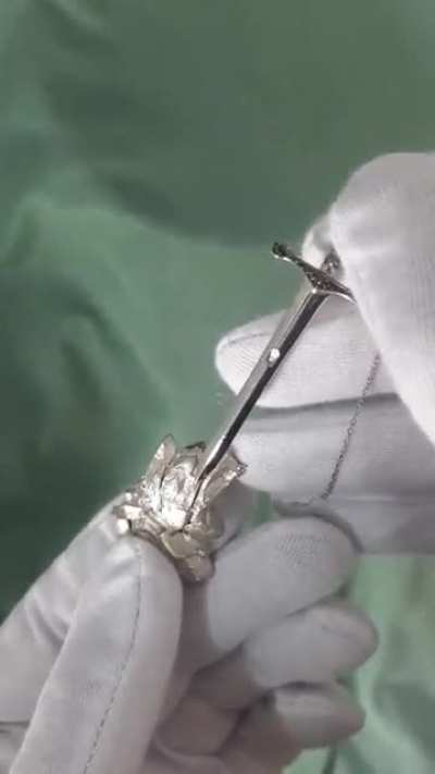 This excalibur necklace that requires pressing a hidden button on the stone to wield.. umm.. to wear.