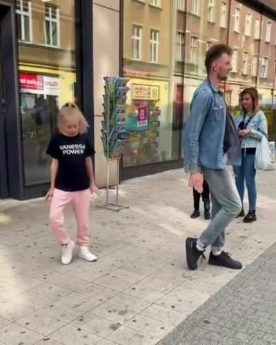 This Little Girl is a fast learner ! She got some smooth dancing skills . Thanks to this dude !