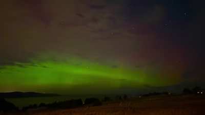 Meteor captured during Northern Lights timelapse. Meteor at the 5 second mark and the Northern Lights go off at the 20 second mark. Middle Cove, Newfoundland. 1/20/26.