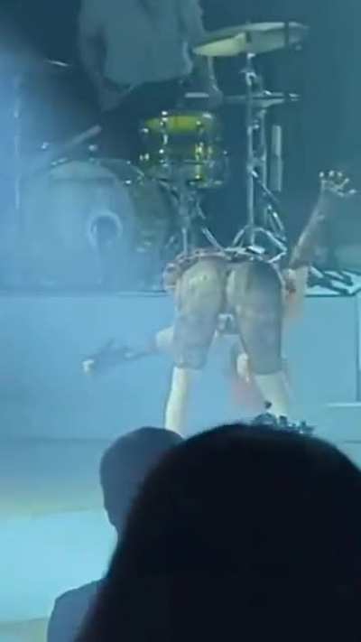 Hayley Williams bending over in a mini-skirt