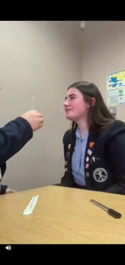 Trying to take a covid test while ticking
