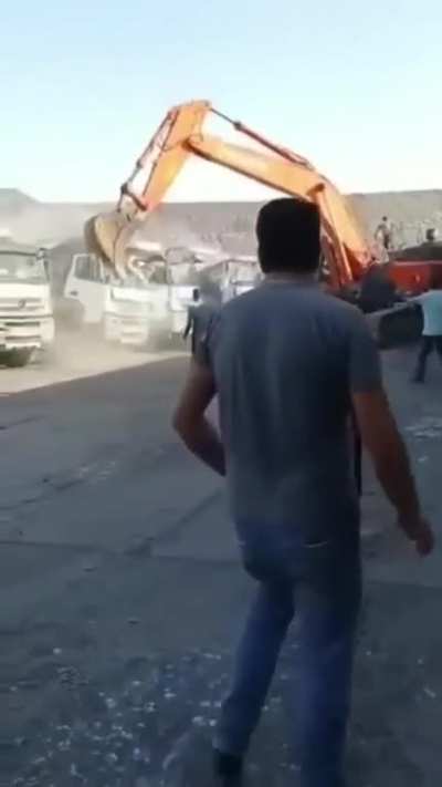 man destroys trucks using excavator in turkey for not paying salary
