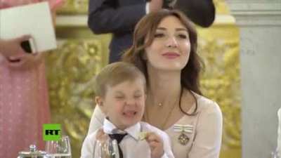Kid tasting a lime at a ceremony