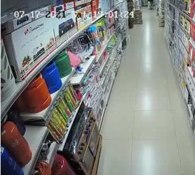 Girl sets a large supermarket on fire, as she dances and laughs - 1
