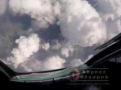 Russian SU-34 fighter-bomber releasing 2x UMPB D-30SN guided bombs