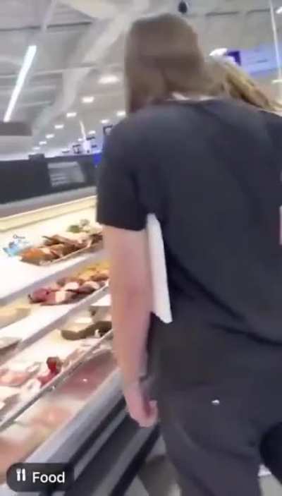 A bunch of Vegan/Vegetarian activists put a red flower on meats to morn their death.