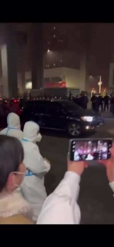 Standoff between protestors calling for end of Covid Lockdown and police in Urumqi, China at Urumqi City Hall