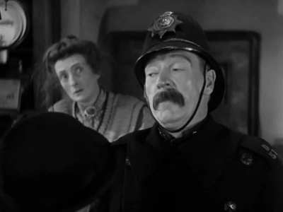 The effects used to turn Claude Rains into "The Invisible Man" (released on Oct 31st, 1933) were done by shooting with a completely black set with walls and floors made to be non-reflective, and then by covering Claude from head to foot with black velvet 