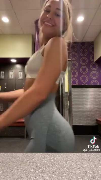 Gripping her own ass