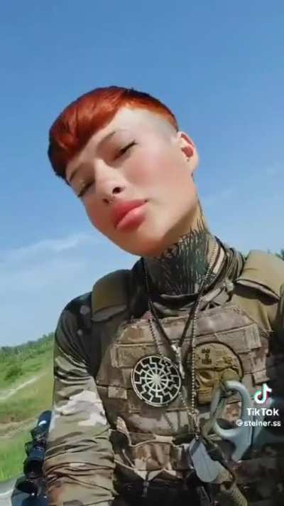 ru pov: Ukrainian paramedic sporting a Black Sun and a Totenkopf style patches.