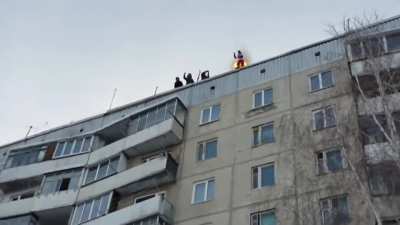 russian man sets himself on fire and jumps from the roof of a pannel home, survives with nearly no injuries