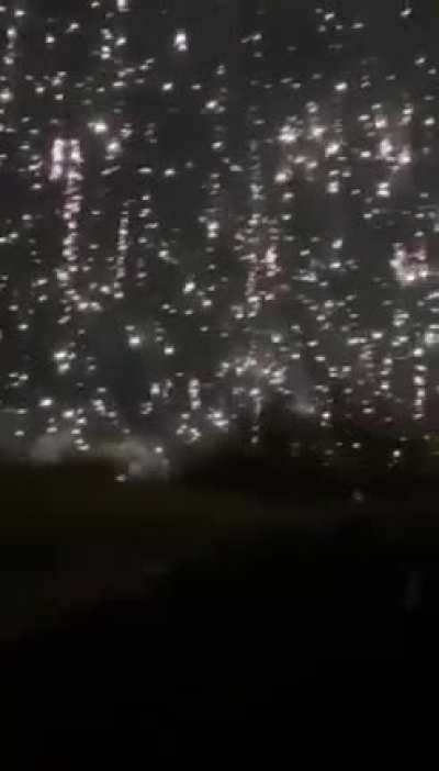 Surreal footage of Ukrainian serviceman caught directly under incendiary ordnance.