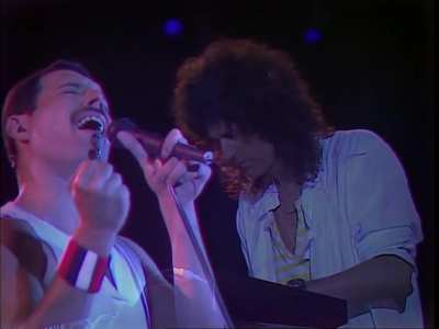 Queen performing "Who Wants to Live Forever" at Wembley Stadium in 1986