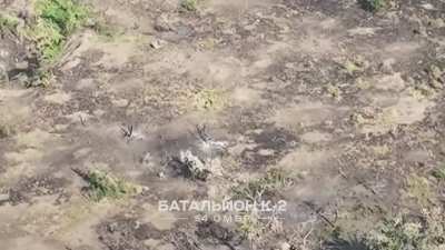 Ukrainian 54th Mechanized Brigade's "Battalion K-2" witnessed a pair of Russian soldiers walking across an open field in the direction of a Ukrainian trench position. One of the two Russians is hit with small arms fire, while the other retreats