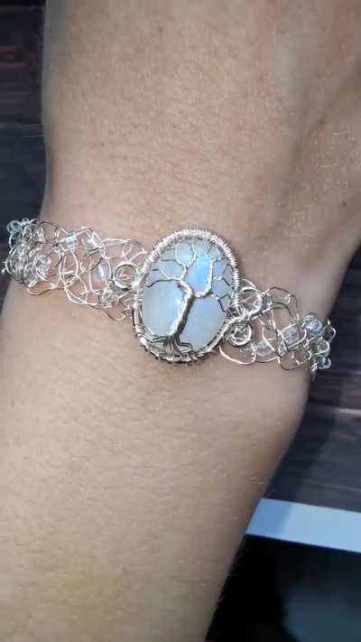 I made an elven bracelet. The tree is wire wrapped and the band is wire crocheted.