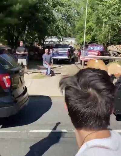 Disgusting: Trump supporters mockingly re-enact George Floyd's murder as protestors march nearby.