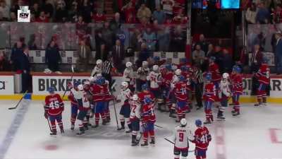 Anderson and Wilson fight on the Washington's bench as the rest of their teams come together.