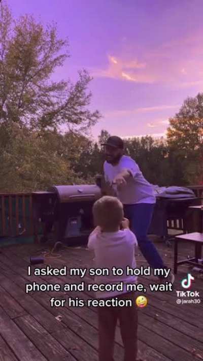 Kid recording his dad dance