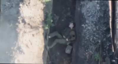 UA drone drops a grenade into a Russian trench, wounding one soldier and forcing another to choose rescue a drone over his comrade. These days. Music from source