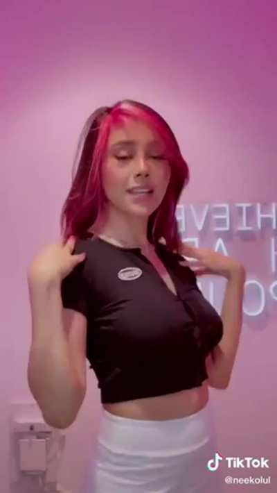 It looks like she’s braless and those buttons are putting in some serious work! Enjoy!