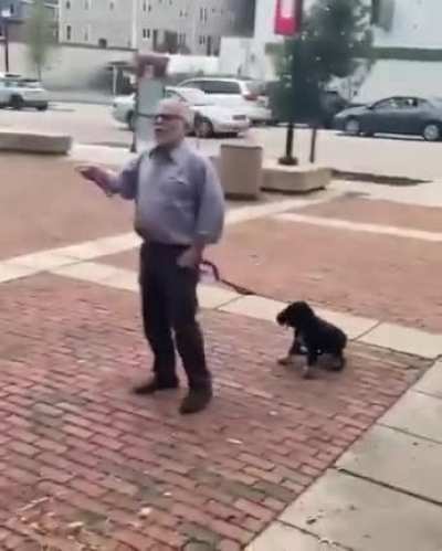 Old guy with dog freaks out at skater
