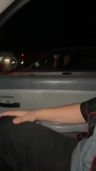 Throwing a drink at a car