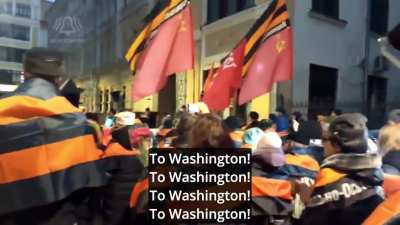 Brainwashed Russian citizens marching through Moscow shouting "To Washington. Enemy USA" and proclaiming "We are like martyrs - will go to heaven and they will just die". Ironically, to the rhythm of the song "We Will Rock You" by Queen
