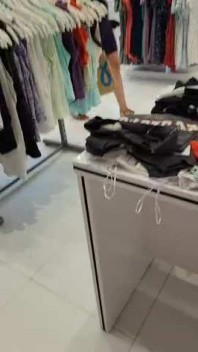 Flashing at the middle of the clothing store [gif]