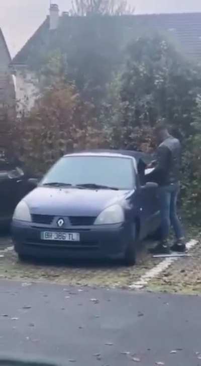 this guy trying to set a car on fire