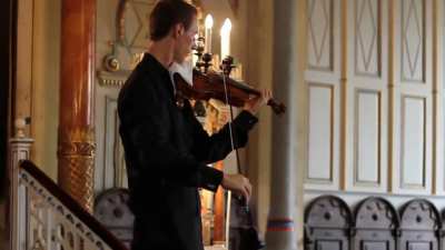 Someone's phone rings during a violin performance