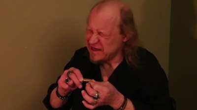 Playing a 1.5" pendant harmonica