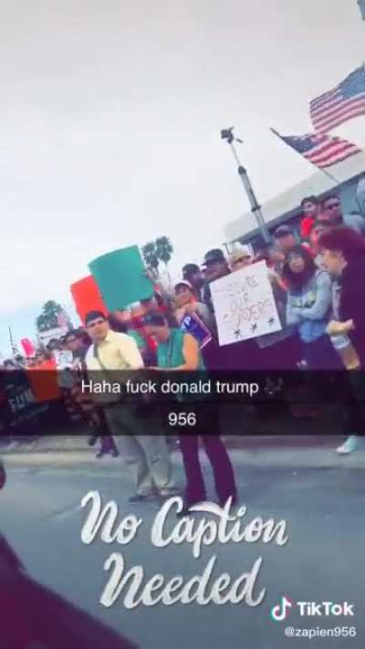 Blasting “Fuck Donald Trump” in a trump parade