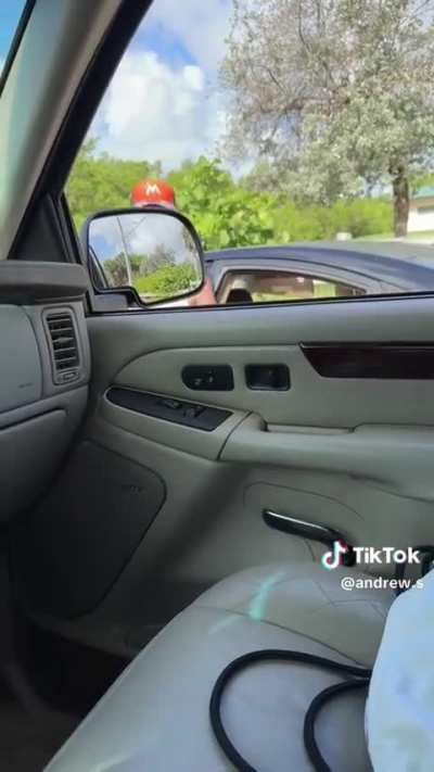 Woman gets out of her car to argue, gets pinned by her own car