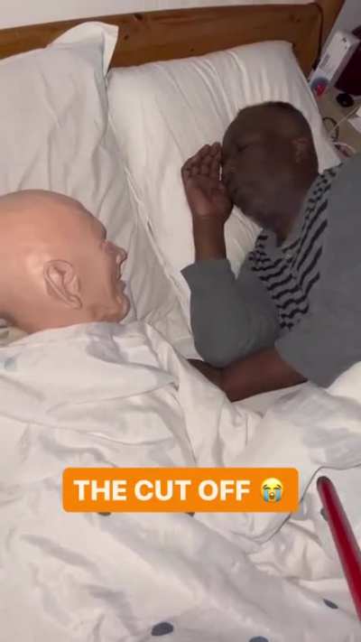 Guy places mannequin head in front of his sleeping father