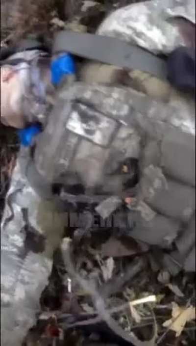 RU pov, Russian soldier records himself planting "explosive gifts" on UA corpses