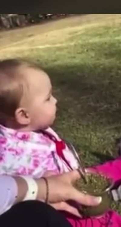 baby tries herbal tea for the first time