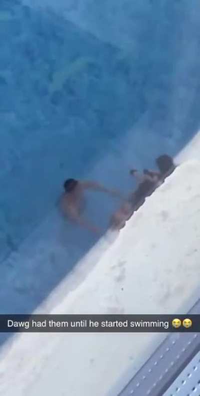 man trying to impress girls with his swimming skills