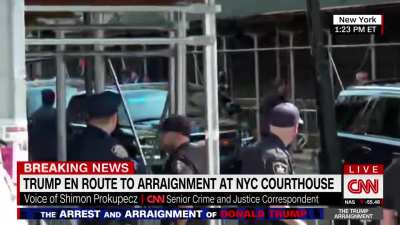 Footage of Donald J Trump walking into NYC Courthouse to be placed under arrest.
