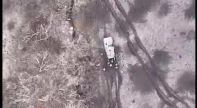 video showing a drone from the Ukrainian 59th motorized brigade showing them hit a group of russian soldiers with a drone drop F-1 grenade. [music from source]
