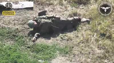 Russian soldier freezes up after hearing an FPV drone approaching, he is subsequently hit and loses a foot. Video by the Strike Drones Company (47 OMBr).