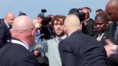 Comedian gatecrashes Trump golf course event with swastika golf balls