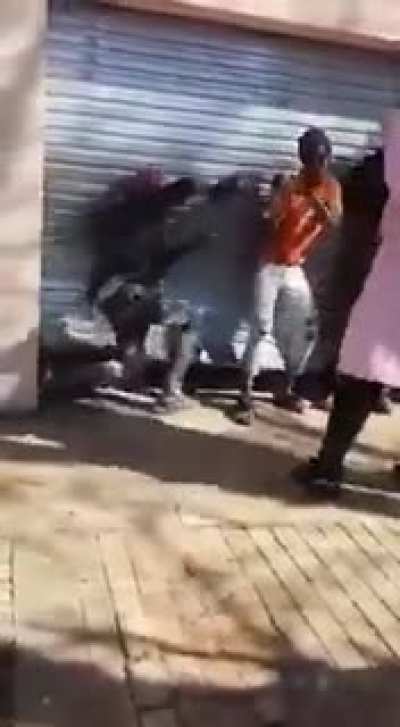 South African woman beating looters