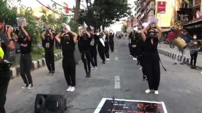 "The Rapist is you "women march on Kathmandu streets to protest rising rape incidents playing traditional music.