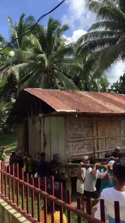 Philippine villagers relocate a widower&rsquo;s home so he could live closer to family. The journey took 2 hours